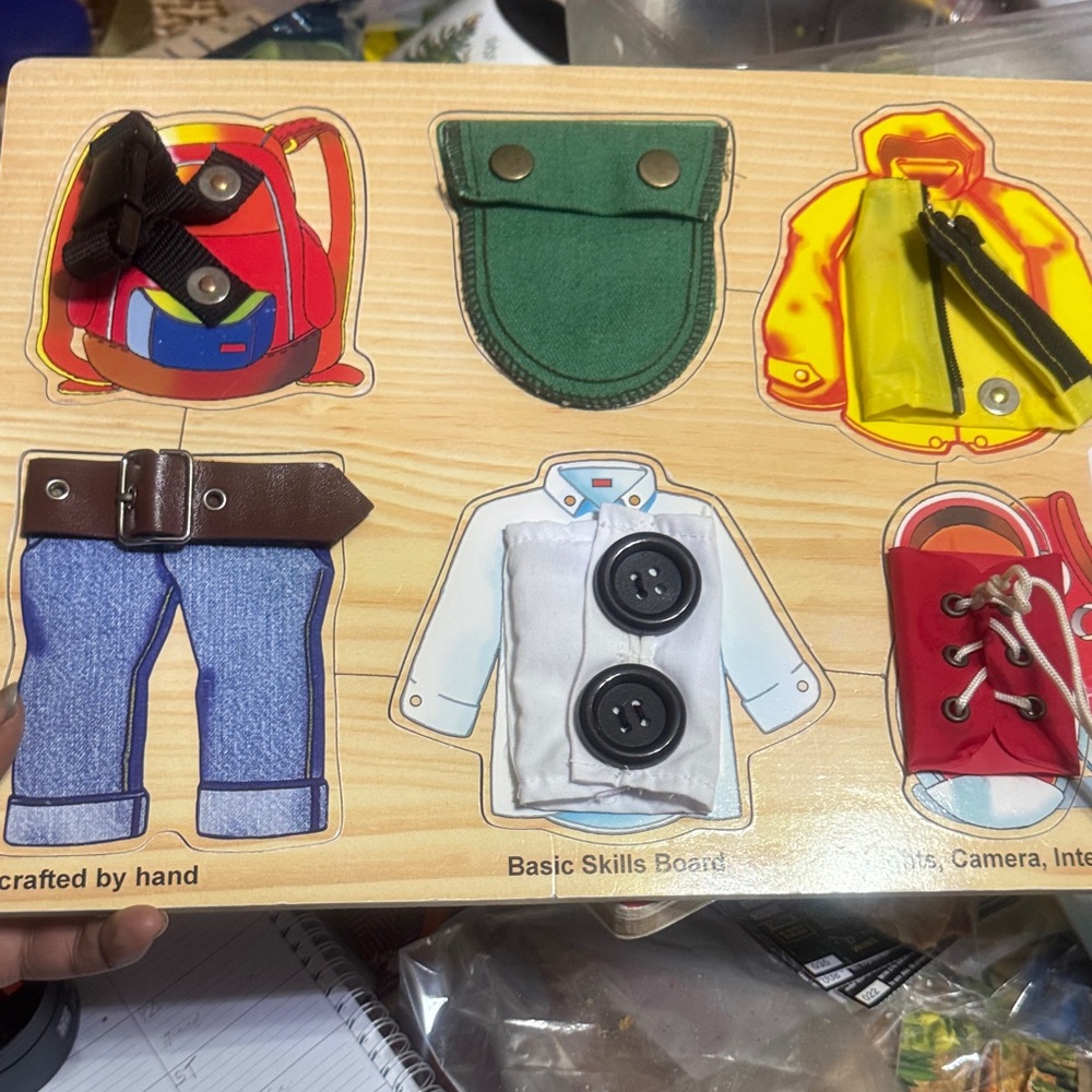 Melissa & Doug Basic Skills Board with Red, Green, Yellow, Blue Outfits